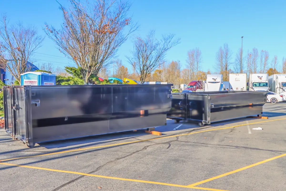 Professional dumpster rental service with roll-off container on residential driveway in Deltona